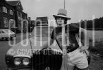 29-06-1976 Elton John in Amsterdam, The Netherlands. June 29, 1976.

[keywords]Black & White Image, Sunglasses, Hat, Scarf, Car, Half Length[/keywords]